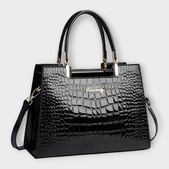 Emilie | Borsa a mano in pelle di coccodrillo lucida" can be rewritten as:

"Emilie | Borsa a mano in pelle lucida effetto coccodrillo